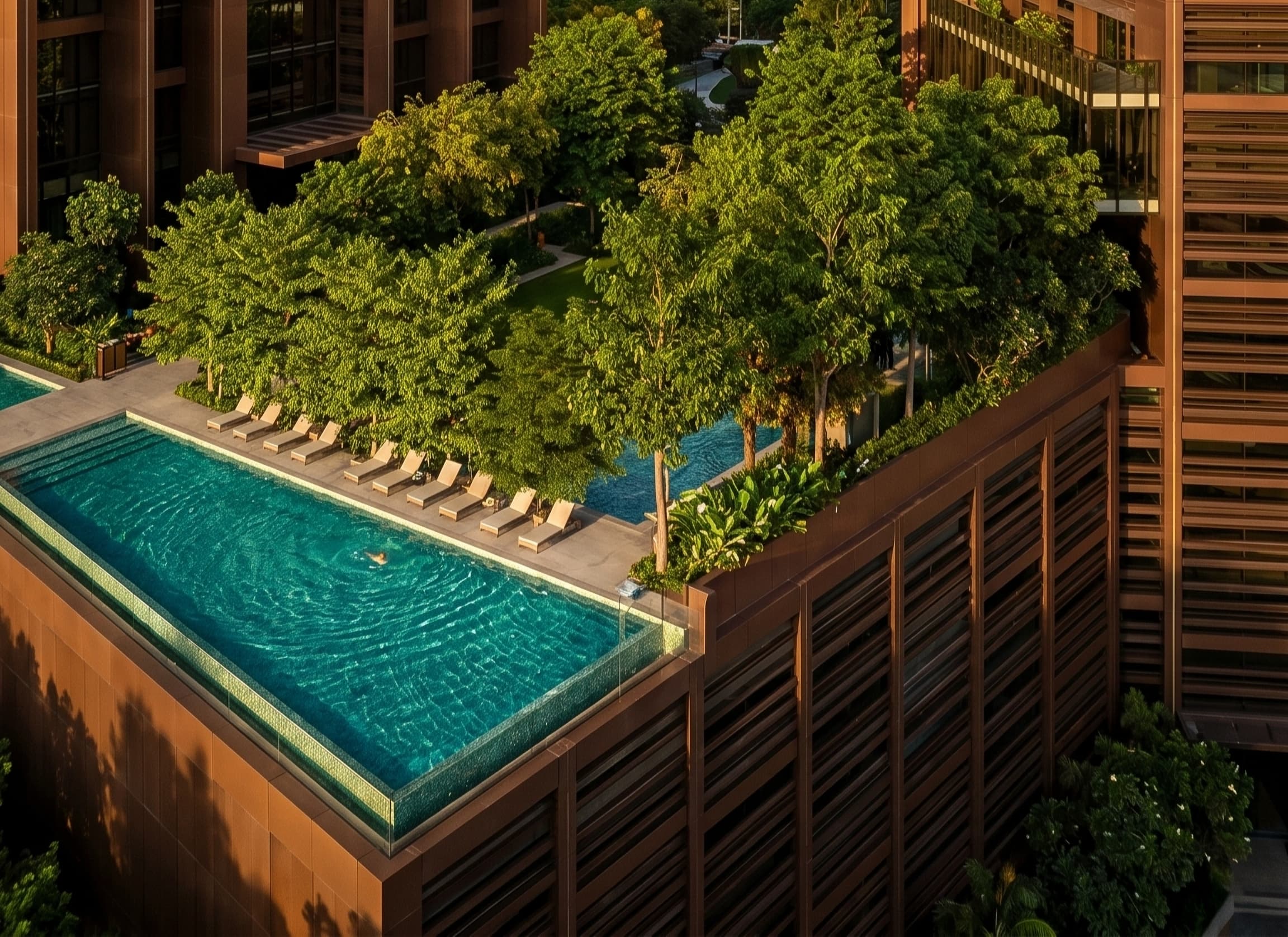 A landscaped pool deck at Runwal Raaya